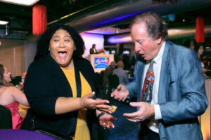 St. Louis comedy meeting corporate stage and closeup magician Jeff Lefton performing for smiling adults