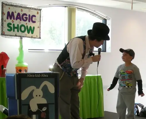 comedy magic show with young boy assistant
